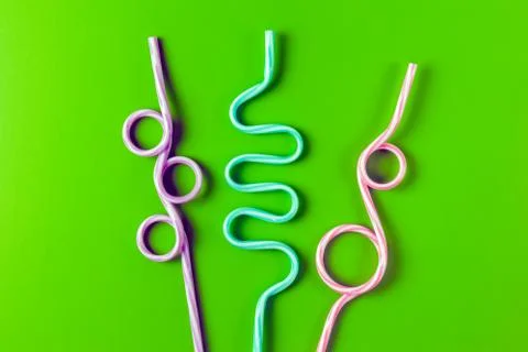 Tubes for drinks on a green background macro. place for the label Stock Photos