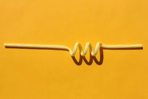 Tubes for drinks on a yellow background macro. place for the label Stock-Fotos