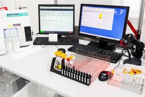 Tubes with examples stand on table in lab Stock Photos