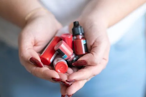 Tubes with pigments for permanent lip makeup on a light background Stock Photos