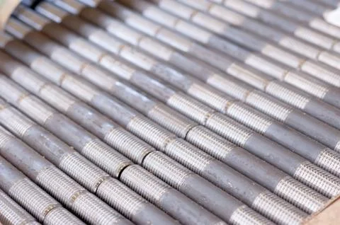 Tubes with threaded threads. in production. finished parts in a row Stock Photos