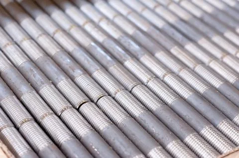 Tubes with threaded threads. in production. finished parts in a row Stock Photos