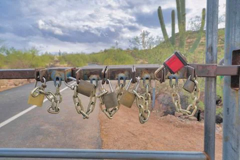 Tucson, Arizona- Multiple padlocks with chains on a gate Stock Photos