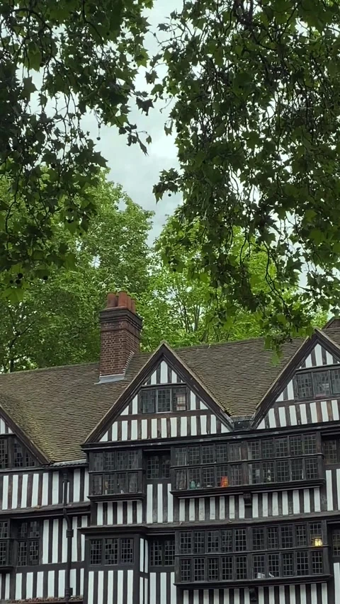 Tudor Style Building with Tree Leaves in London 4K Vertical Video 스톡 동영상 335018978