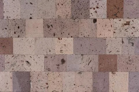 Tuff stone wall as background and texture Stock Photos