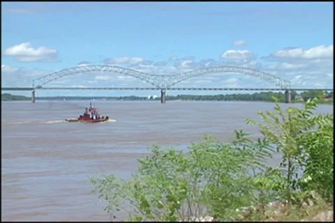 Tug boat and memphis bridge Stock Footage
