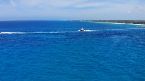 Tug Boat &amp; Container Cargo Ship At Sea Near Freeport Harbor Freeport Bahamas Stock Footage 107639130