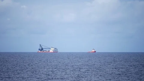 A tug boat pulling an accommodation barge Stock Footage 74779675