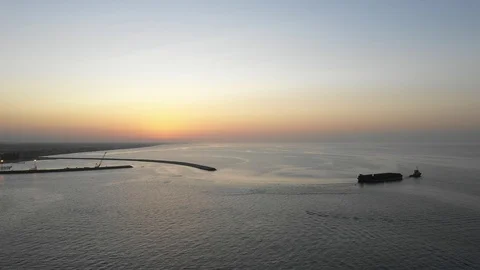Tug Boat Pulling Barge during Sunset Stock Footage 118494525