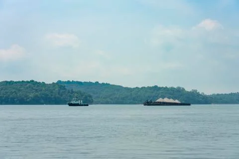 Tug boat pulling a barge Stock Photos