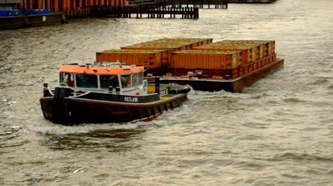Tug Boat pulling barge on Thames River Stock Footage 36595513