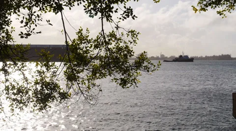 Tug boat pulling container cargo sea barge vessel Stock Footage 33473004