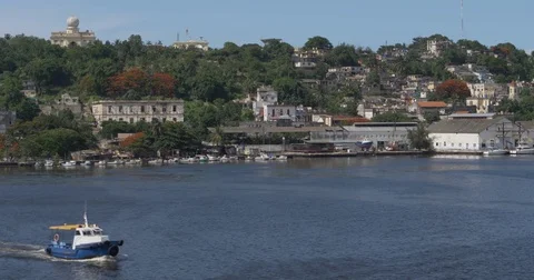 Tug Boat Travels Past Havana Landscape Stock Footage