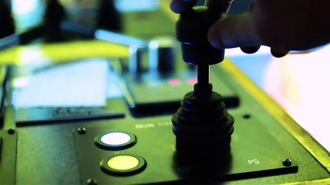 Tug master controls pilot engine. Close-up of hands in a low light Stock Footage 72495356
