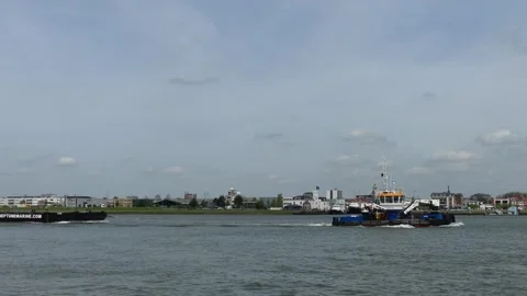 Tug pulling barge on river 動画素材 273971757