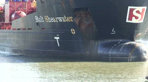 Tug pulling huge tanker into dock. HD 1080i Stock Footage 66936
