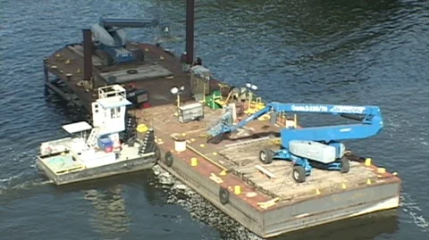 Tug pushes Bridge Construction barge Stock Footage 105553247