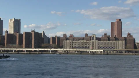 A tug sails towards Manhattan Bridge, New York City. Stock Footage 33710413