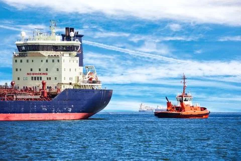 Tug with ship Stock Photos