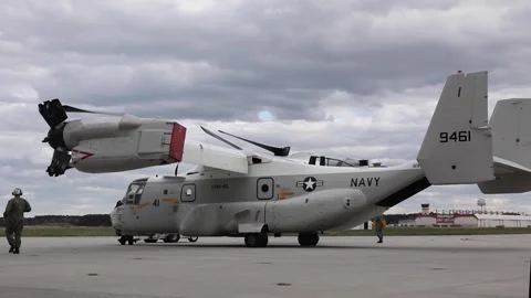 Tug towing U.S. Navy CMV-22B Osprey at Naval Station Norfolk Stock Footage 271233724