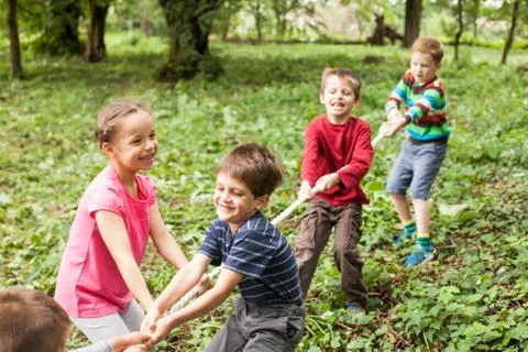 Tug-of-war in park Stock Photos