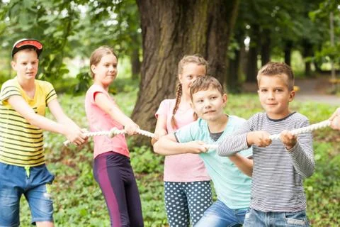 Tug-of-war in park Stock Photos