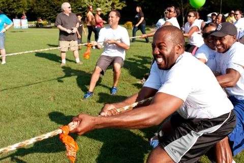 Tug-of-war teams pull rope in summer fundraising event Fotos de archivo