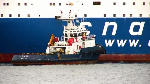 Tug working with general cargo ship. Stock Footage 112624645