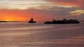 Tugboat and Barge in Channel At Sunrise 4k or 4k+ Resolution