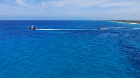 Tugboat and Container Cargo Ship at Sea Near Freeport Harbor, Bahamas Stock Footage 107639279