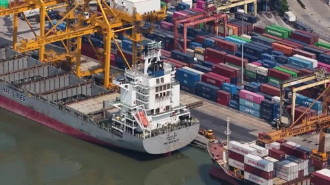 Tugboat assisting cargo ship docking in commercial port Vídeos de archivo 328489733