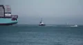 Tugboat Assists Container Ship Entering Port HD Footage