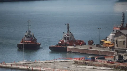 Tugboat docks at the pier 01 Stock Footage 126876113