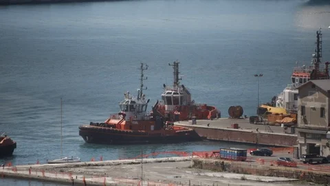 Tugboat docks at the pier 02 Stock Footage 126877014