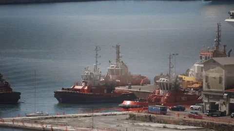 Tugboat docks at the pier 03 Stock Footage 126877273