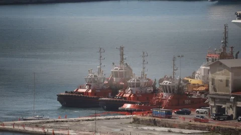 Tugboat docks at the pier 04 Stock Footage 126877041