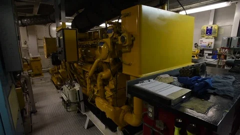 Tugboat engine room walk around showing Caterpillar main engine, gear. Stock Footage 70055330