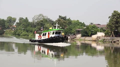 A tugboat is floating on the river Stock Footage 165653299