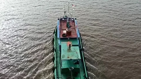 Tugboat moving through the  river Stock Footage 312459749