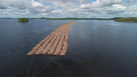 Tugboat pulling rafts of logs Stock Footage 339614556