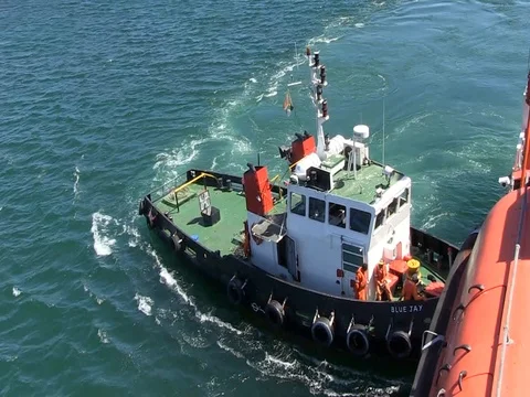 Tugboat pushing Stock Footage 84753594