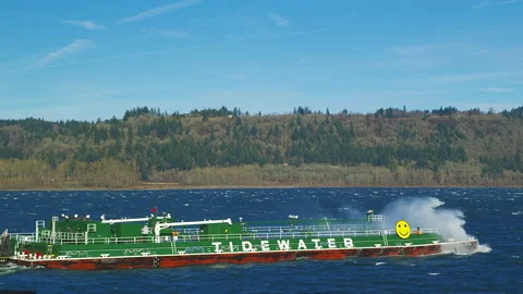 Tugboat pushing hard against current and wind on the Columbia River Stock Footage 228491382