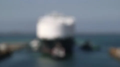 Tugboat At The Stern Of Cargo Ship Stock Footage 63988662