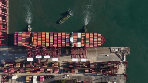 Tugboats pulling large container ship from port terminal Vídeo Stock 333674822