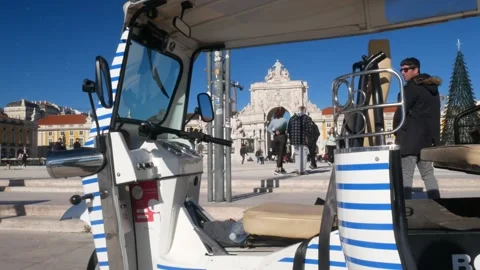 Tuk Tuk at Praca do Comercio, also known as Terreiro do Paco, Lisbon Stock Footage 263158191