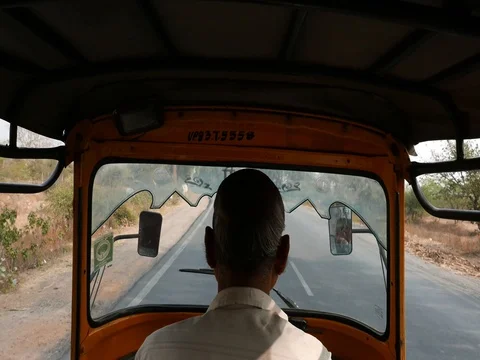 Tuk tuk ride on indian bumpy road. View from inside. Video stock 83376387