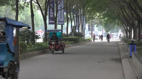 Tuk Tuks driving down sidestreet in Chengdu, China Stock Footage 39743539