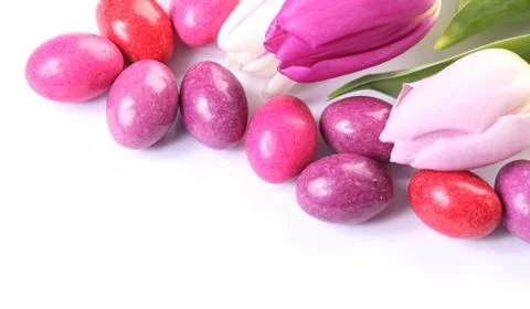 Tulips and candy eggs Stock Photos