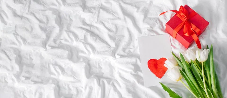 Tulips flowers, red gift box and empty card with heart for text. Mockup. Co.. 写真素材