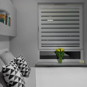 Tulips on windowsill Stock Photos